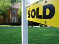 Closing a Mortgage? What Consumers Can Expect From New Disclosure Forms picture of a sold sign in front of a house