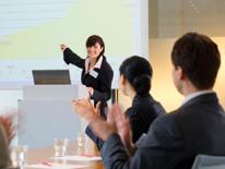 Speaker Making a Presentation to a Group photo of woman giving presentation to small group